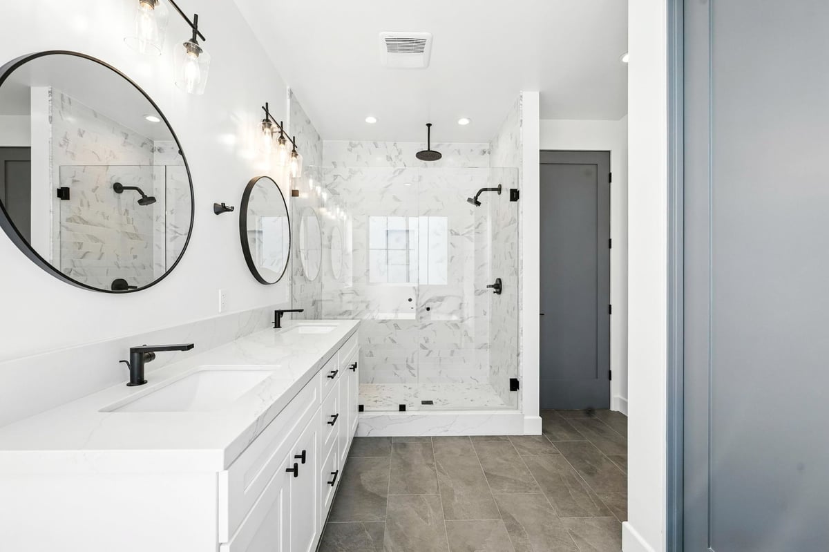 Modern bathroom with double vanity and soaking tub