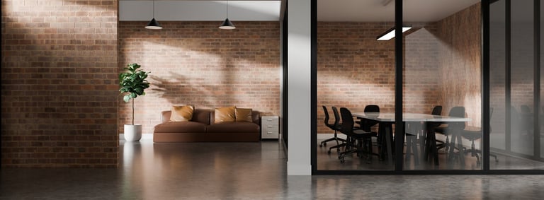 3D Modern industrial office interior with brick walls, glass meeting room, and a cozy seating corner in a contemporary workspace.